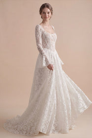 Load image into Gallery viewer, AKAY Gelinlik’e ait uzun kollu dantel A kesim gelinlik modeli. Transparan detaylı üst beden, floral işlemeler ve zarif kuyruk formuyla modern romantik bridal couture tasarım.

